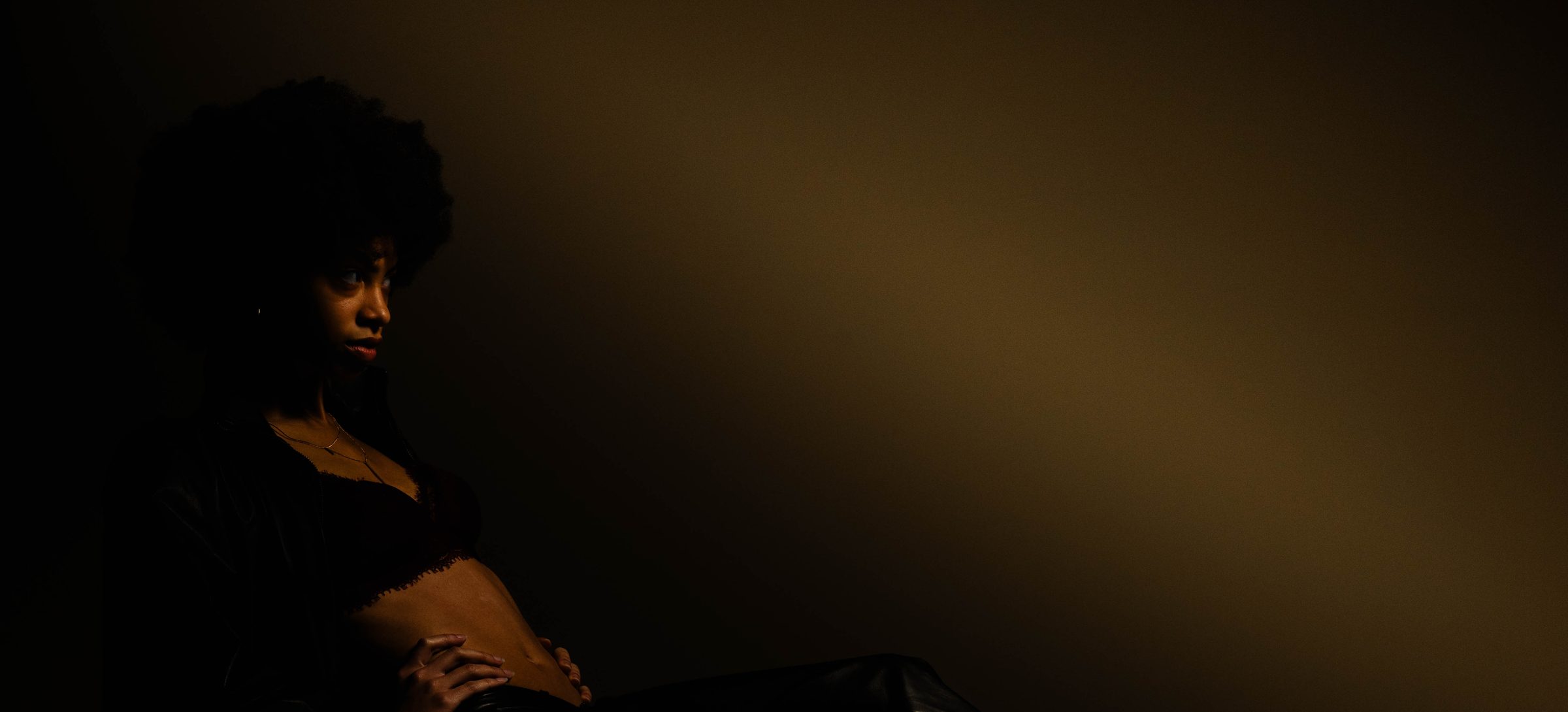 ari LaVon in low amber light